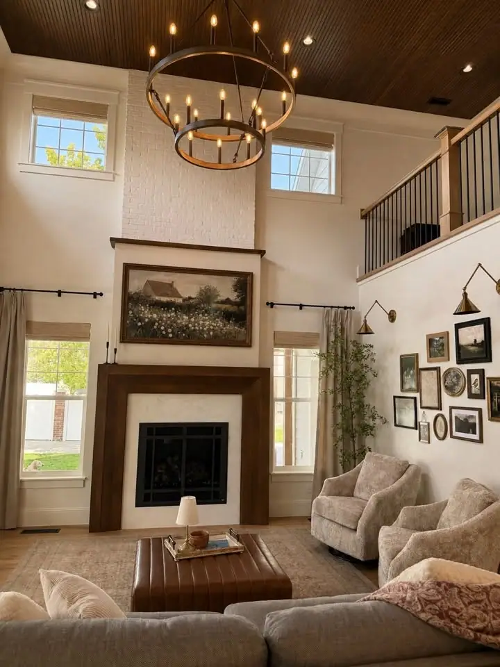 Two-story great room with custom fireplace surround and pad