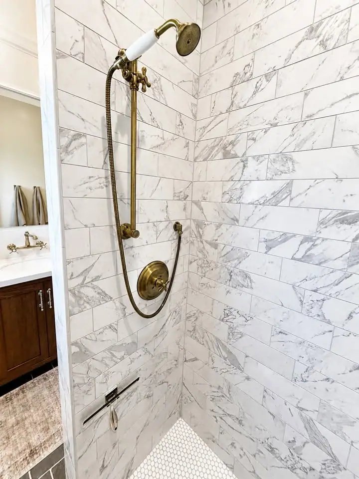 Marble shower with brass handheld fixture